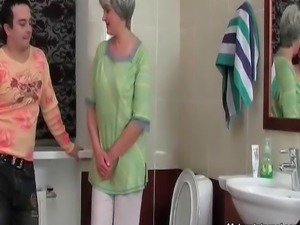 Horny dude enters the bathroom where her mature whore is pissing. He wants...