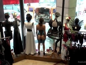 A slutty brunette gets humiliating, by being obliged to stand as a mannequin...