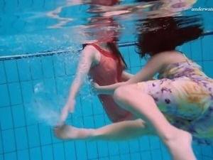 Sweet and fresh Russian teen babes in the pool tangle and undress