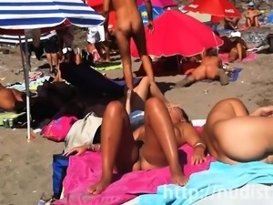 Sexy nudist ladies in nature's garb on the beach