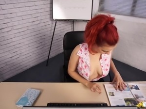 Awesome red haired secretary Dolly flashes her appetizing boobies