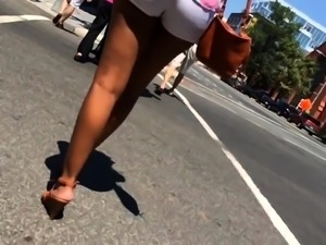 Street voyeur follows a beautiful girl in tight white shorts