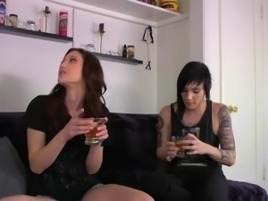 Two alternative lesbians with some tattoos use pink strapon for hot sex