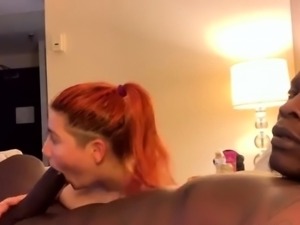 Redhead milf satisfies interracial needs in motel room