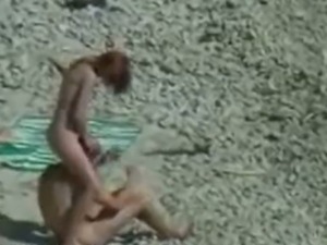 Nude lovers at the beach doing naughty things