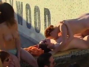 Swinger pool party with everyone fucking in the water