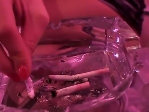 Cute blonde is smoking for all you that have a smoking fetish. The solo girl...