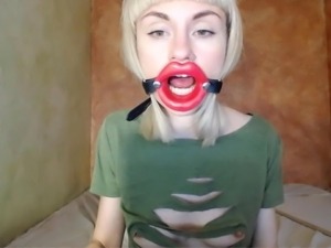 Zooming in red lips open mouth gag for dildo-blowjob.