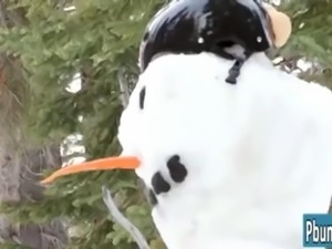 Cute brunette fucks snowman