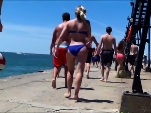 Beach voyeur follows a sexy bikini girl with a lovely ass