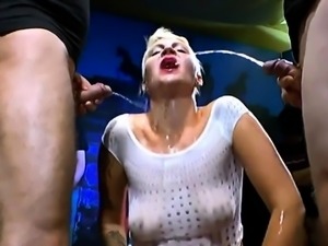 Short haired blonde gags on horny men's cum loaded cocks