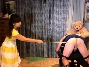 Merciless mistress spanking servant's ass in BDSM training